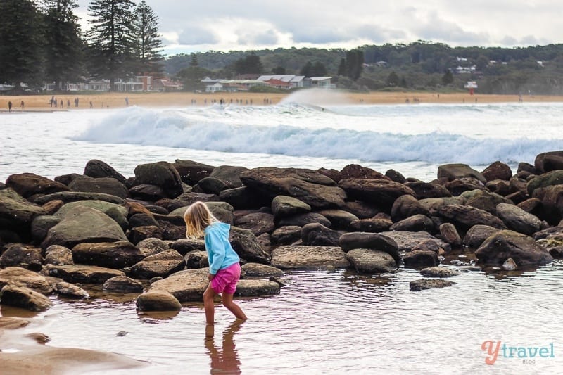 a girl standing in water