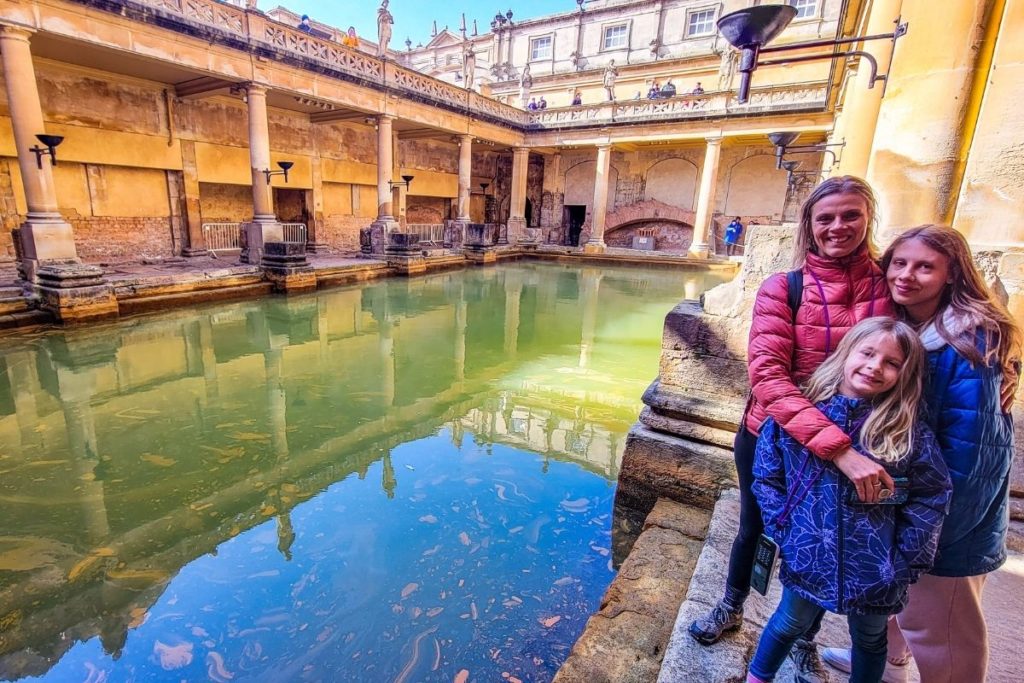 people standing next to a body of water