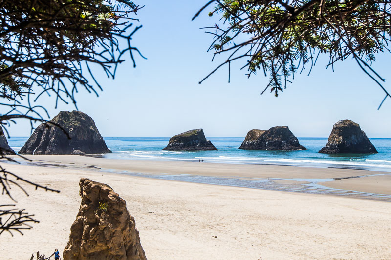 beach with large rocks in the water