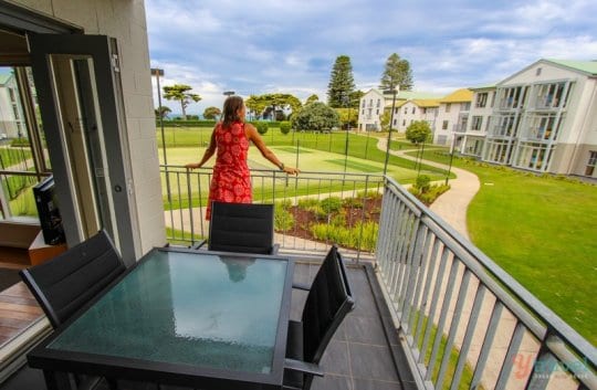 woman standing on a balcony