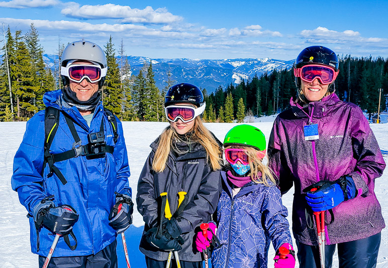 people in ski gear on a snowy mountain