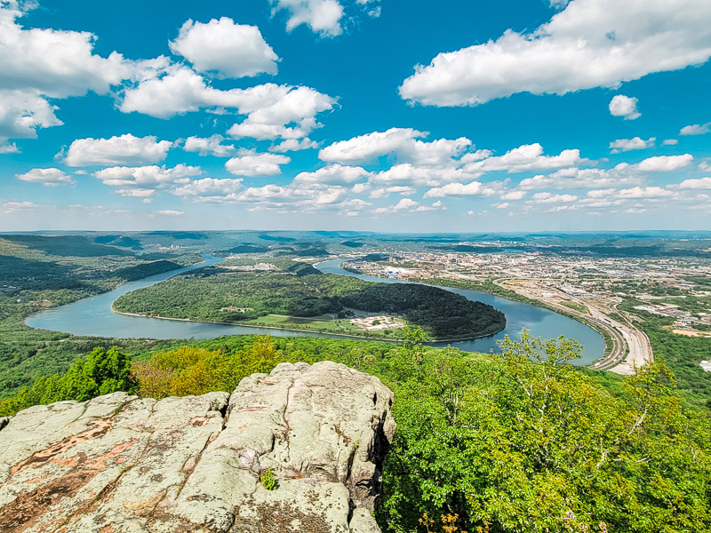 A large body of water with a mountain in the background