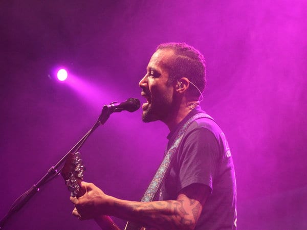 a man singing into a microphone