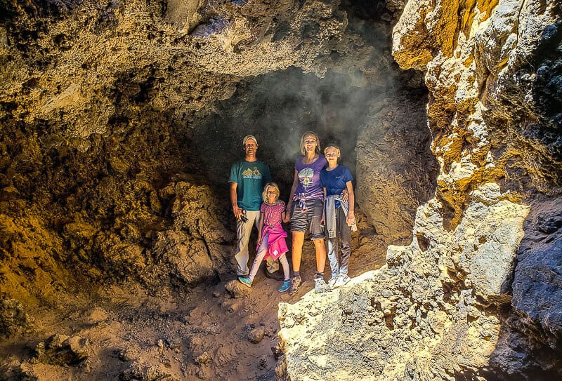 people standing in a cave