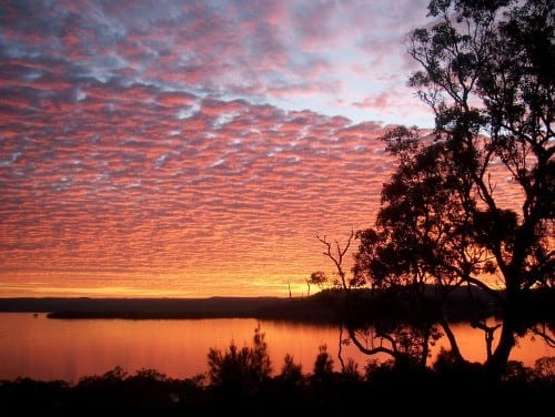 A sunset over a body of water