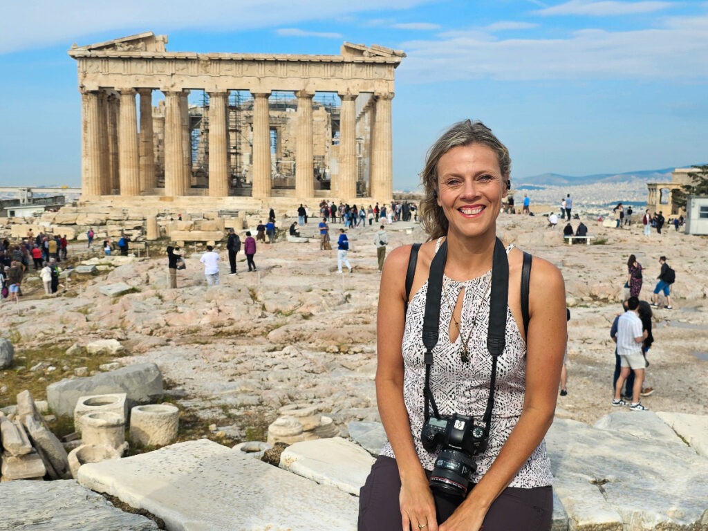 Lady getting her photo in front of a historic site in Athens, Greece