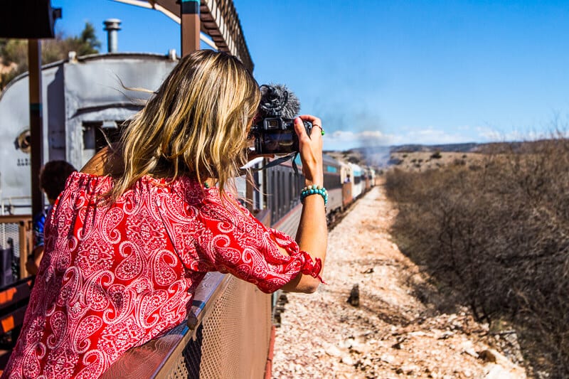 woman leaning out of a train window