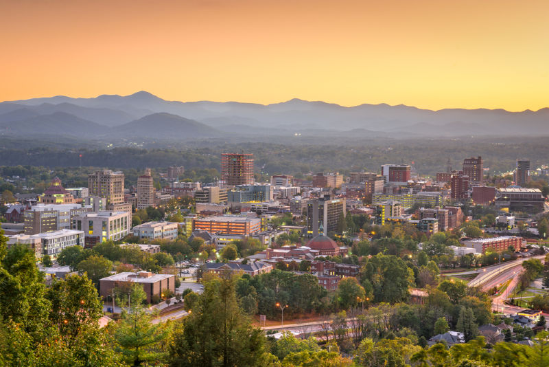 A view of a city with a mountain in the background