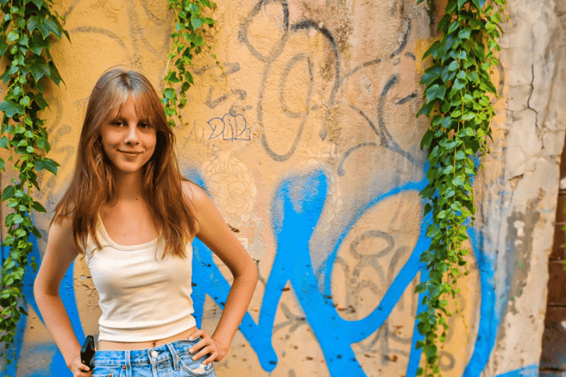 kalyra standing in front of graffiti wall in rome